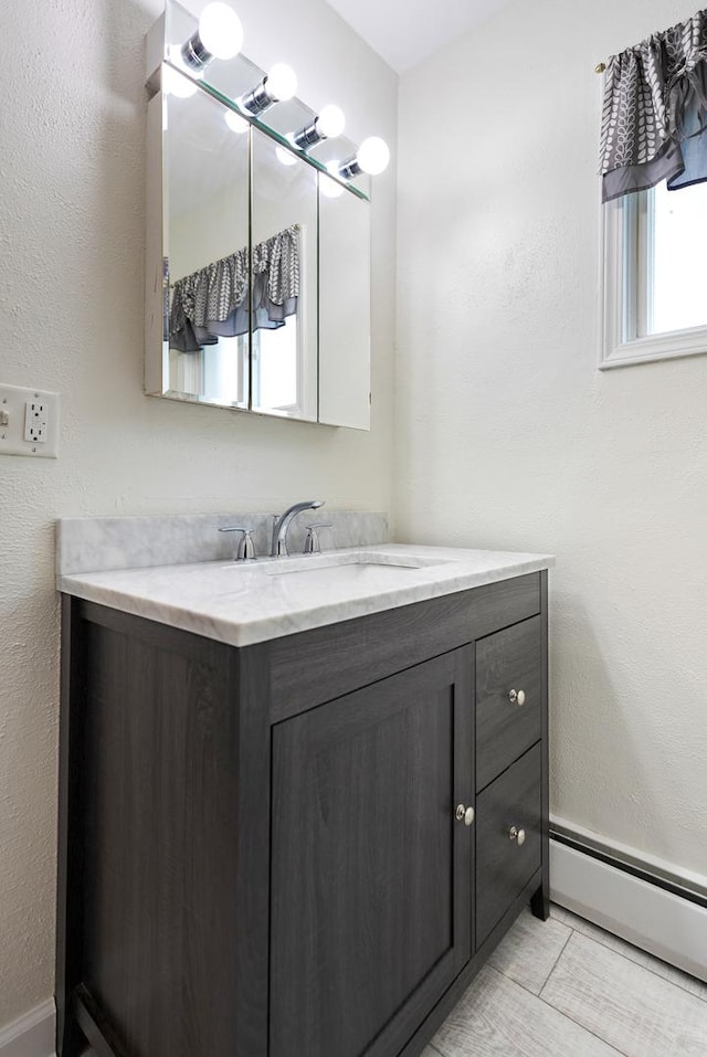 550 N Center St, South Elgin, IL 60177 - bathroom with a baseboard radiator and vanity