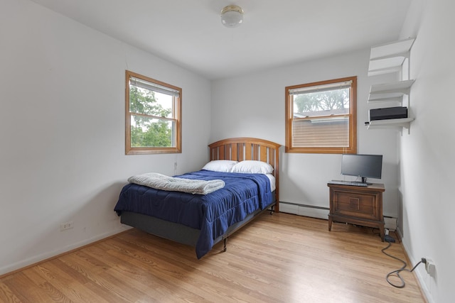 550 N Center St, South Elgin, IL 60177 - bedroom with a baseboard heating unit and light wood finished floors