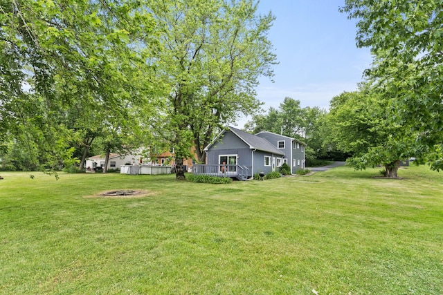 550 N Center St, South Elgin, IL 60177 - view of grassy yard featuring a fire pit and a deck