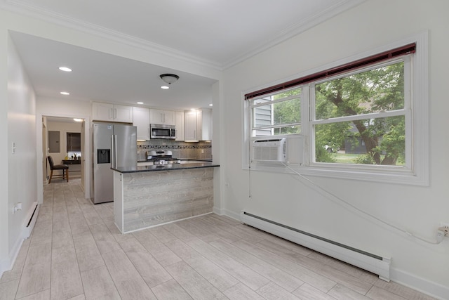 550 N Center St, South Elgin, IL 60177 - kitchen with stainless steel appliances, baseboard heating, cooling unit, dark countertops, and white cabinetry
