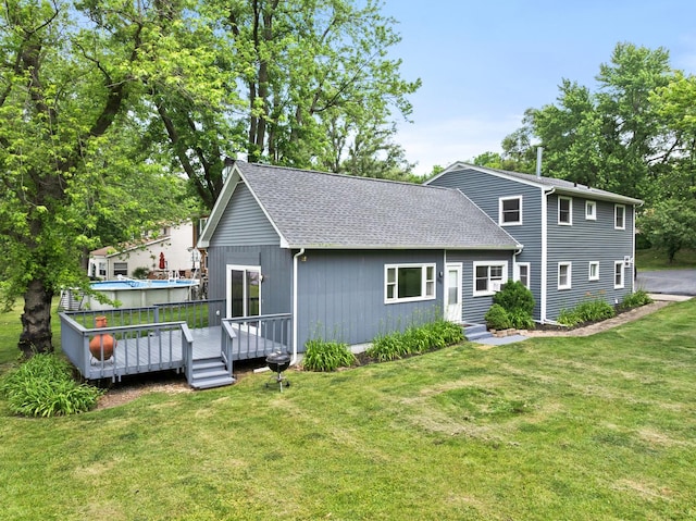 550 N Center St, South Elgin, IL 60177 - back of property with a deck, a lawn, and roof with shingles