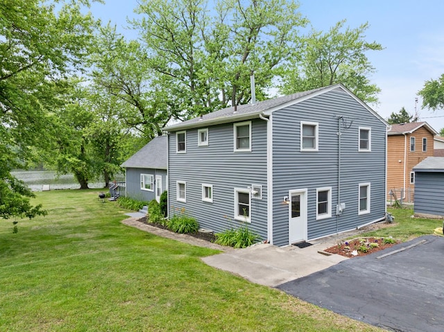 550 N Center St, South Elgin, IL 60177 - back of property featuring a yard and a patio area