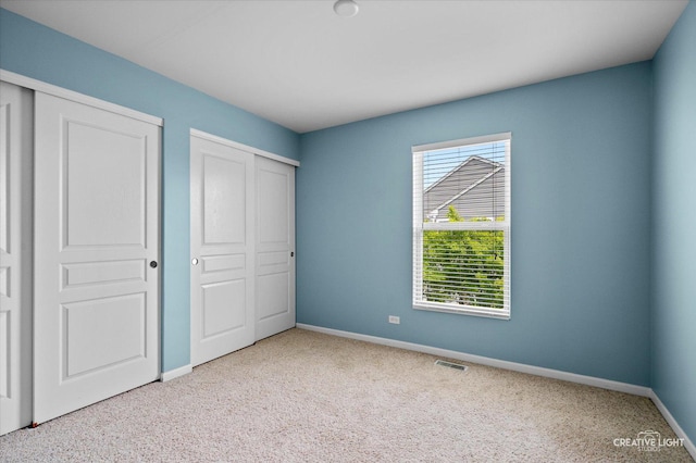 114 Devoe Dr N, Oswego, IL 60543 - unfurnished bedroom featuring carpet flooring and a closet