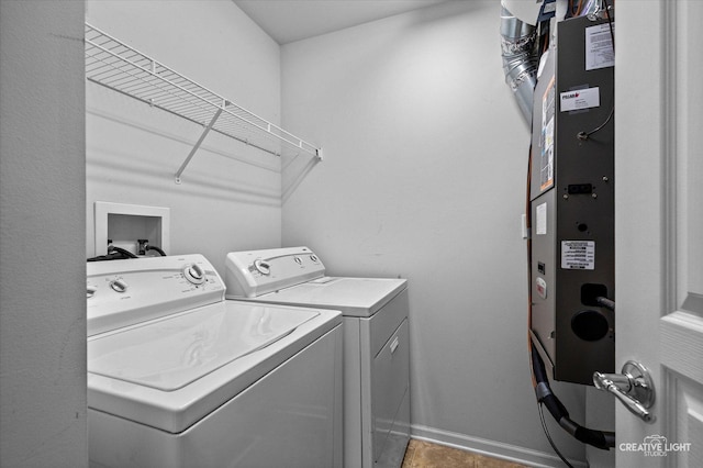 114 Devoe Dr N, Oswego, IL 60543 - laundry room with washer and clothes dryer and baseboards