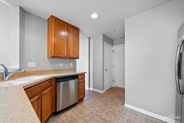 114 Devoe Dr N, Oswego, IL 60543 - kitchen featuring appliances with stainless steel finishes, light countertops, light tile patterned floors, recessed lighting, and brown cabinetry