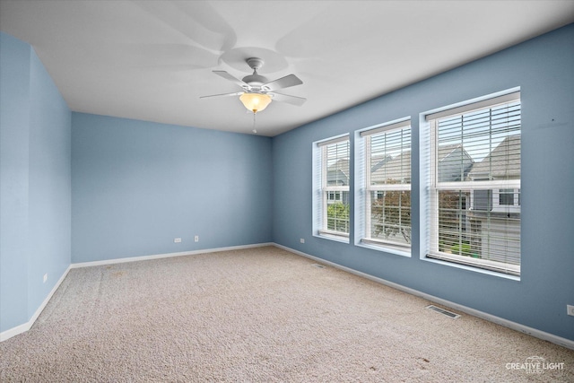 114 Devoe Dr N, Oswego, IL 60543 - empty room featuring carpet flooring and ceiling fan