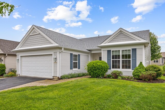 11692 Sunderlin Dr, Huntley, IL 60142 - view of front of house with asphalt driveway, an attached garage, a front lawn, and roof with shingles