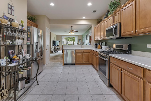 11692 Sunderlin Dr, Huntley, IL 60142 - kitchen featuring stainless steel appliances, a ceiling fan, a peninsula, light countertops, and recessed lighting
