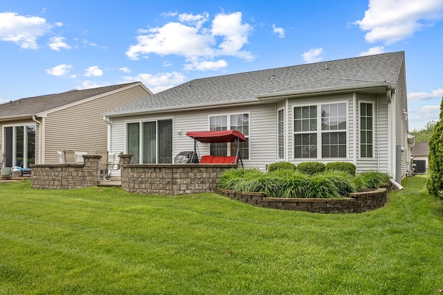 11692 Sunderlin Dr, Huntley, IL 60142 - rear view of house with a yard and roof with shingles