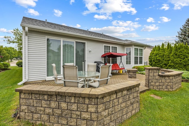 11692 Sunderlin Dr, Huntley, IL 60142 - rear view of property featuring a patio area, a yard, roof with shingles, and outdoor dining space