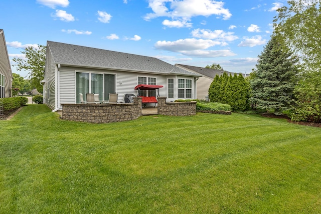 11692 Sunderlin Dr, Huntley, IL 60142 - back of property featuring a lawn and roof with shingles