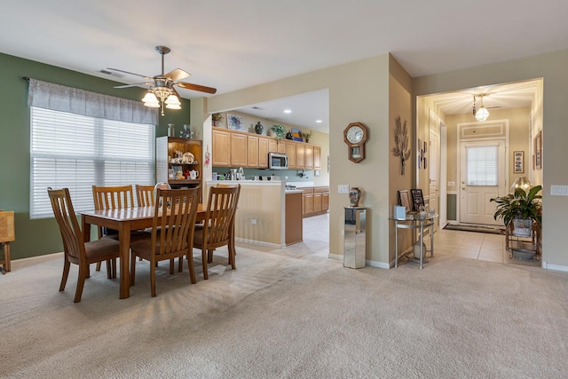 11692 Sunderlin Dr, Huntley, IL 60142 - dining area featuring a ceiling fan and light carpet