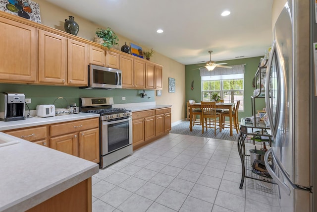 11692 Sunderlin Dr, Huntley, IL 60142 - kitchen with stainless steel appliances, light countertops, recessed lighting, light tile patterned floors, and a ceiling fan