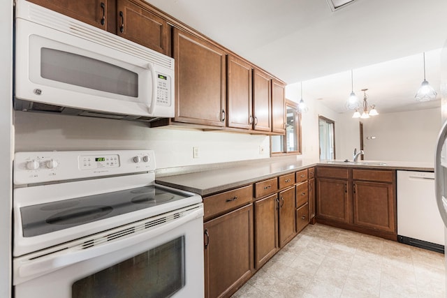 102 Mattek Ave, Dekalb, IL 60115 - kitchen featuring white appliances, decorative light fixtures, and light tile patterned floors