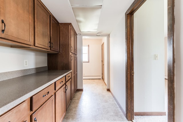 102 Mattek Ave, Dekalb, IL 60115 - kitchen with a baseboard radiator and baseboards
