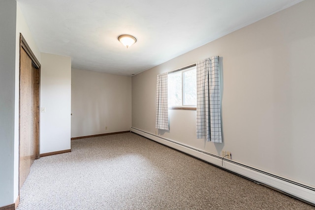 102 Mattek Ave, Dekalb, IL 60115 - unfurnished bedroom with baseboard heating and carpet floors