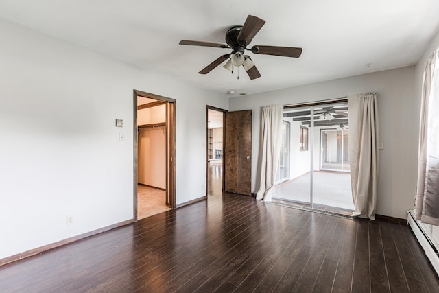 102 Mattek Ave, Dekalb, IL 60115 - spare room featuring a baseboard heating unit, ceiling fan, and wood finished floors