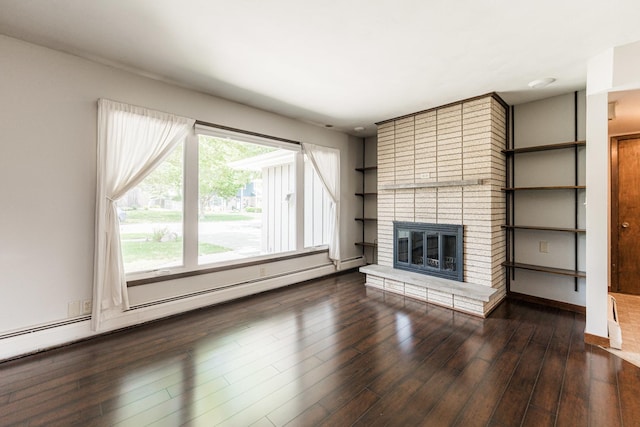 102 Mattek Ave, Dekalb, IL 60115 - unfurnished living room with a fireplace and wood finished floors