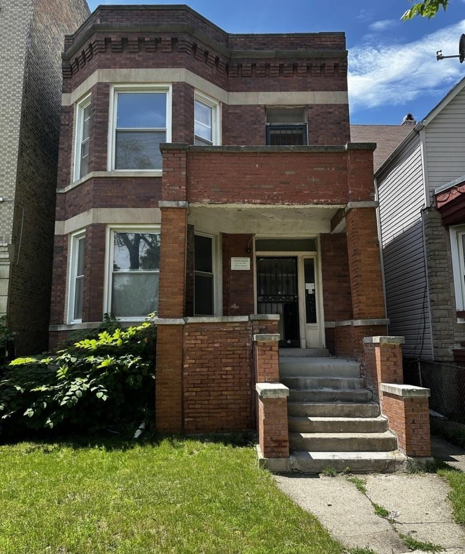 7142 S Lowe Ave, Chicago, IL 60621 - view of property with brick siding and a porch