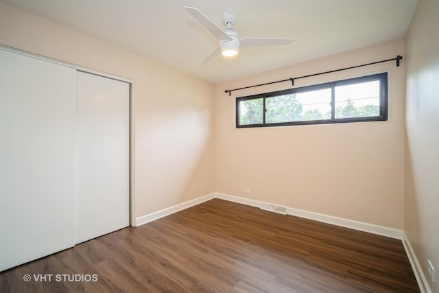 135 Flora Ave, Glenview, IL 60025 - unfurnished bedroom with wood finished floors, a closet, and ceiling fan