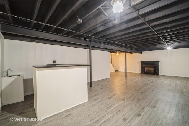 135 Flora Ave, Glenview, IL 60025 - finished basement featuring a fireplace and wood finished floors