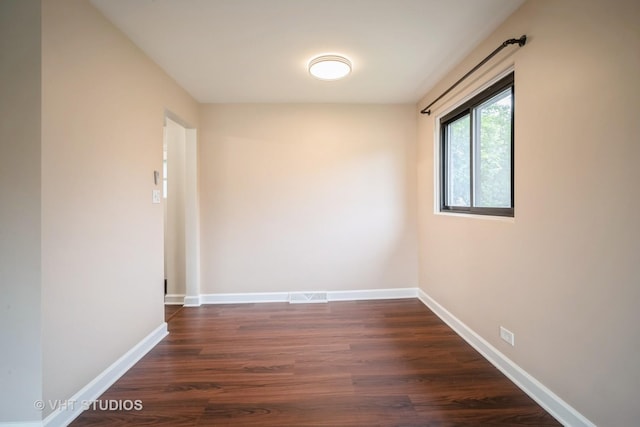 135 Flora Ave, Glenview, IL 60025 - unfurnished room with dark wood-type flooring and baseboards