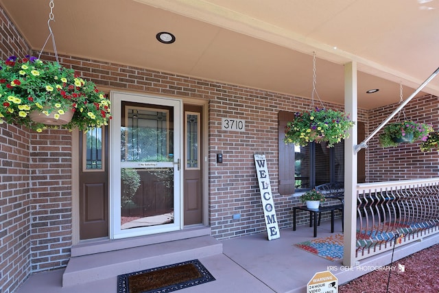3710 Spy Glass Ridge Rd, Crystal Lake, IL 60012 - doorway to property featuring a porch and brick siding