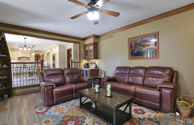 3710 Spy Glass Ridge Rd, Crystal Lake, IL 60012 - living area with ceiling fan, wood finished floors, ornamental molding, and a chandelier