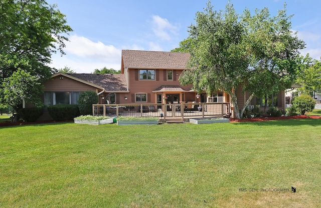 3710 Spy Glass Ridge Rd, Crystal Lake, IL 60012 - rear view of house featuring a yard, a wooden deck, a vegetable garden, and a shingled roof