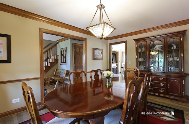 3710 Spy Glass Ridge Rd, Crystal Lake, IL 60012 - dining space with stairs, crown molding, wood finished floors, and a chandelier