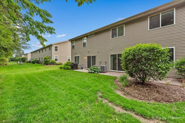 1141 Westlake Dr, Cary, IL 60013 - rear view of property featuring a lawn and a patio