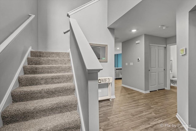 1141 Westlake Dr, Cary, IL 60013 - stairs with wood finished floors and baseboards