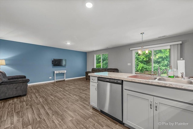 1141 Westlake Dr, Cary, IL 60013 - kitchen with dishwasher, open floor plan, light countertops, wood finished floors, and recessed lighting