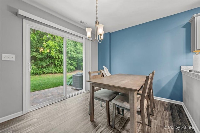 1141 Westlake Dr, Cary, IL 60013 - dining space with a chandelier and wood finished floors