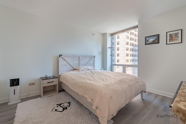 222 N Columbus Dr Unit 912, Chicago, IL 60601 - bedroom featuring wood finished floors, a textured ceiling, and floor to ceiling windows