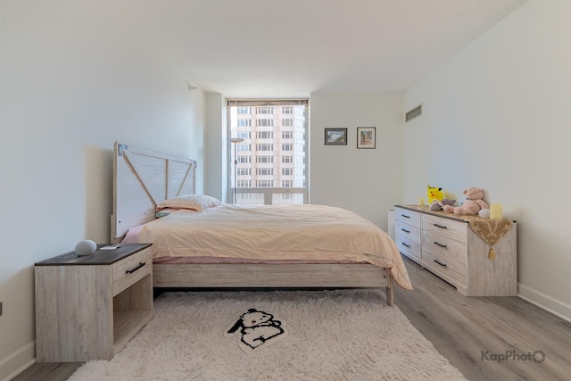 222 N Columbus Dr Unit 912, Chicago, IL 60601 - bedroom featuring light wood-style flooring and baseboards