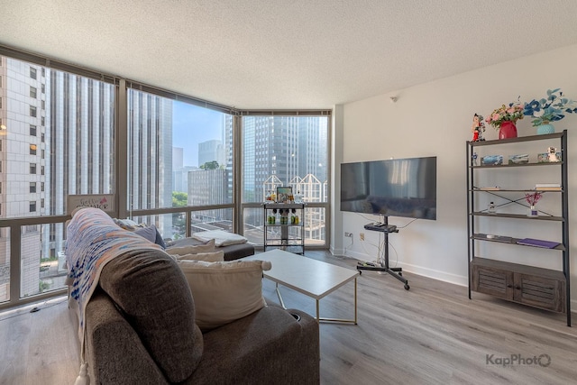 222 N Columbus Dr Unit 912, Chicago, IL 60601 - living area featuring expansive windows, wood finished floors, and a textured ceiling