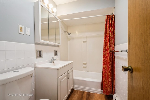 200 Ridge Ave Unit 2C, Evanston, IL 60202 - full bathroom with tile walls, vanity, shower / bath combo, wood finished floors, and wainscoting