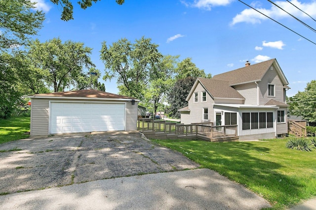 300 Stone St, South Elgin, IL 60177 - view of property exterior featuring a garage, an outdoor structure, a wooden deck, a sunroom, and a yard