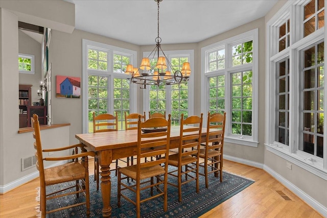 1005 Hiawatha Ln, Riverwoods, IL 60015 - dining area with a chandelier, light wood-type flooring, and plenty of natural light