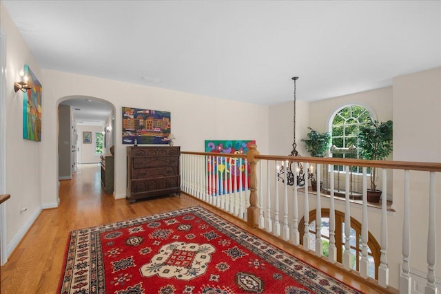 1005 Hiawatha Ln, Riverwoods, IL 60015 - hall with wood finished floors and arched walkways