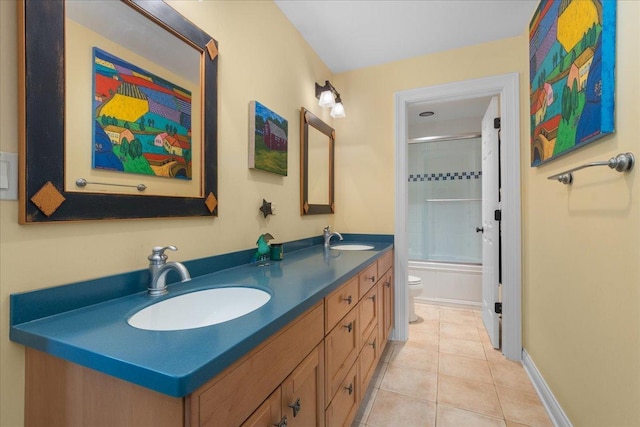 1005 Hiawatha Ln, Riverwoods, IL 60015 - bathroom featuring double vanity, tile patterned floors, and bath / shower combo with glass door