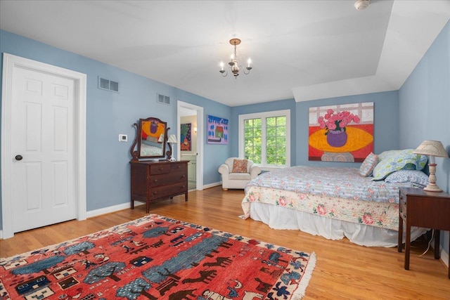 1005 Hiawatha Ln, Riverwoods, IL 60015 - bedroom with a chandelier and wood finished floors