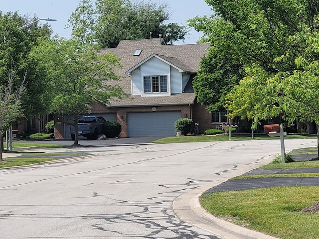 18324 Pond View Ct, Tinley Park, IL 60477 - view of front of home featuring an attached garage, asphalt driveway, brick siding, and roof with shingles
