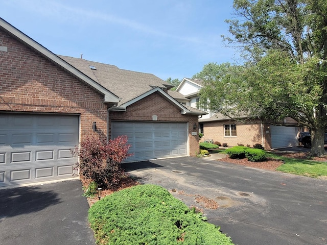 18324 Pond View Ct, Tinley Park, IL 60477 - view of front facade with brick siding, driveway, an attached garage, and a shingled roof