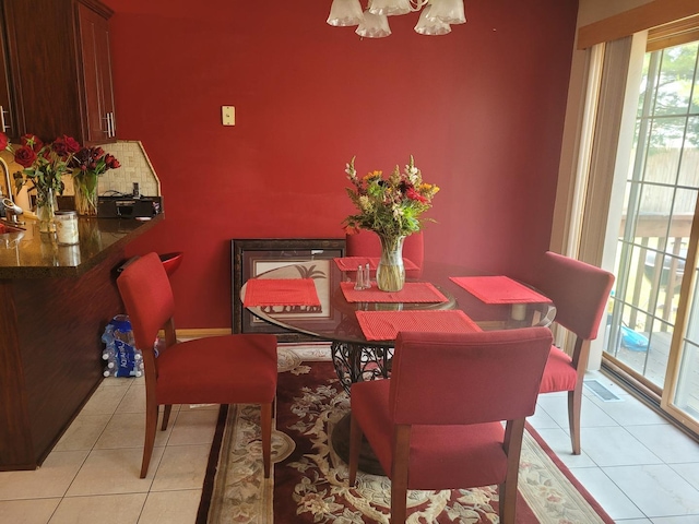 18324 Pond View Ct, Tinley Park, IL 60477 - dining room with light tile patterned floors and a chandelier
