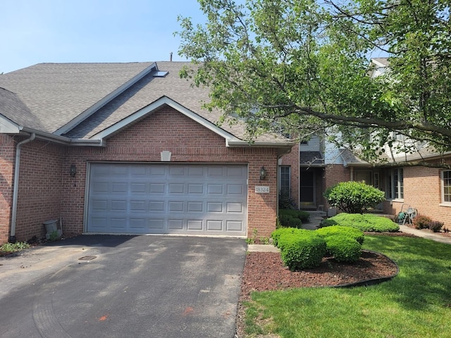 18324 Pond View Ct, Tinley Park, IL 60477 - ranch-style home featuring a shingled roof, driveway, brick siding, and a garage