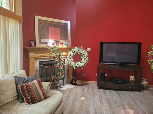 18324 Pond View Ct, Tinley Park, IL 60477 - living room featuring wood finished floors, a fireplace, and a towering ceiling
