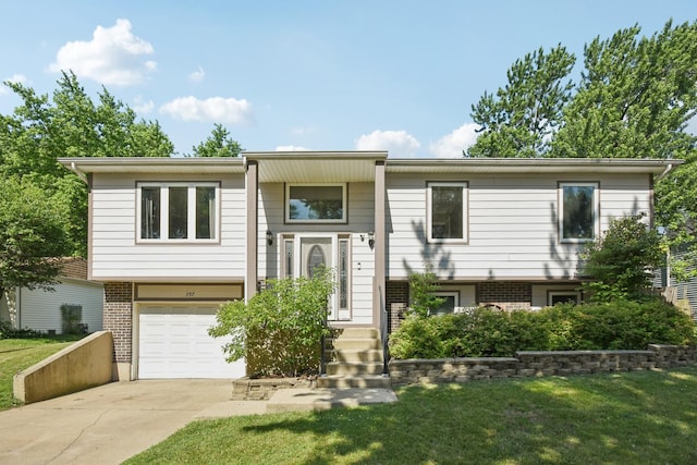 357 Sword Way, Bolingbrook, IL 60440 - bi-level home featuring a garage, brick siding, driveway, and a front lawn
