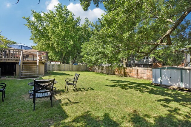 357 Sword Way, Bolingbrook, IL 60440 - fenced backyard featuring stairs, a storage unit, and a wooden deck